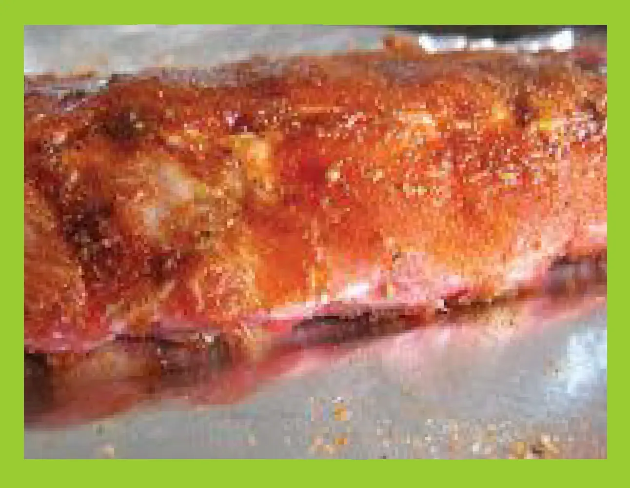 Ribs covered in a dry rub seasoning mixture.
