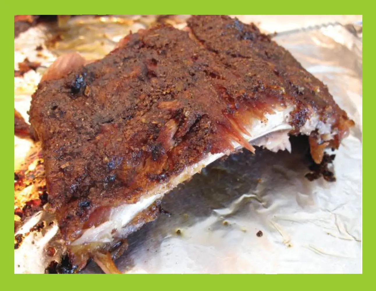 Rack of ribs coated in dry rub seasoning