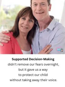 A couple with arms around each other smile at the camera.