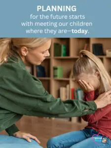 A woman consoles a crying child in front of bookshelves.