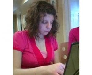 Carly Fleischman typing on a laptop.