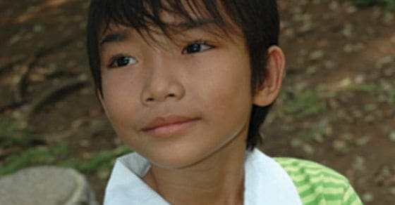 Young boy looking to the side.