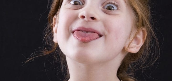 Girl sticking tongue out with a playful expression