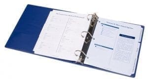 Blue binder open to pages with lists and checkboxes.