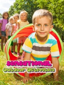 Young boy crawling through a play tunnel with other children behind him