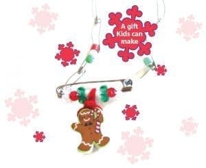 Gingerbread man charm with beads on a safety pin necklace.