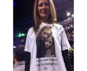 Woman wearing a t-shirt with a photo and text about Paul McCartney