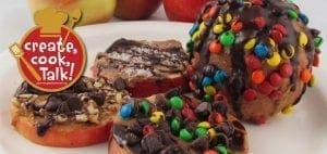 Chocolate caramel apple cookies with various toppings.
