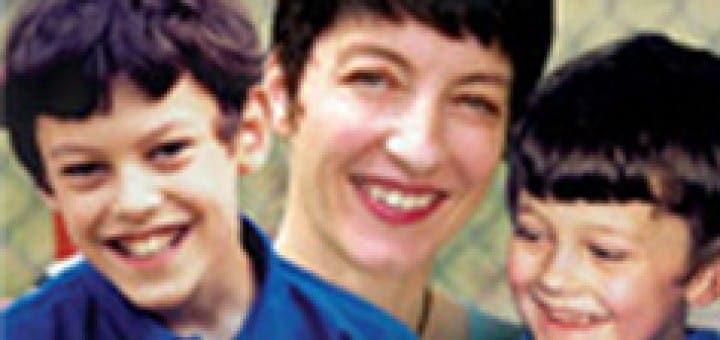 Book cover for Not Stupid, featuring a smiling mother and her two sons with the subtitle about their fight for education.