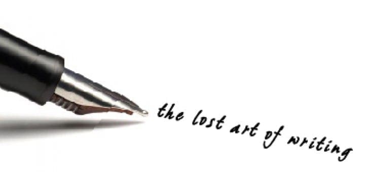 Fountain pen writing "the lost art of writing" on a white surface.