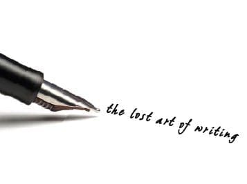 Fountain pen writing "the lost art of writing" on a white surface.