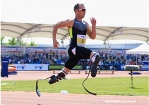 Double-amputee Oscar Pistorius sprints on prosthetic legs during a race.