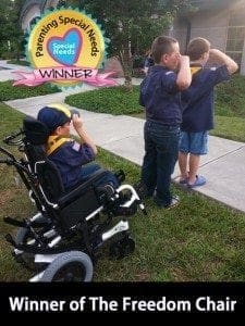 A child in a wheelchair and two other children stand outside, with a "Parenting Special Needs WINNER" seal at the top.