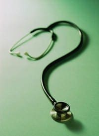 Stethoscope shaped into a question mark, symbolizing the uncertainty of finding health coverage after job loss.