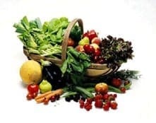 Wicker basket filled with a vibrant variety of fresh seasonal fruits and vegetables to encourage healthy family eating habits