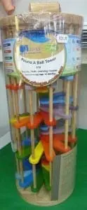 Wooden ball ramp toy with colorful pieces and a label reading "Pound A Ball Tower