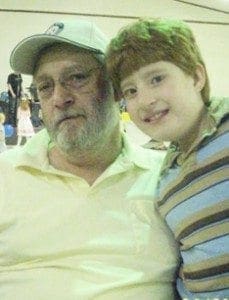 Michael Azzara poses with a young boy, likely his grandson Mikey.