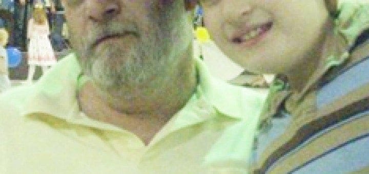 Michael Azzara poses with a young boy, likely his grandson Mikey.