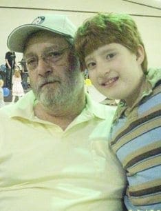 Michael Azzara poses with a young boy, likely his grandson Mikey.