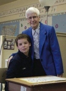 Sister Jeannette Murray stands with a student at The Benedictine School.