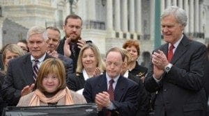 Politicians and advocates gather to celebrate the passage of the ABLE Act.
