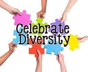 Hands holding colorful puzzle pieces forming the words "Celebrate Diversity.