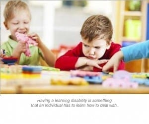 Two young children work on a puzzle at a table.