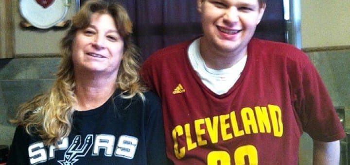 Ethan and his mother stand together, both wearing jerseys.