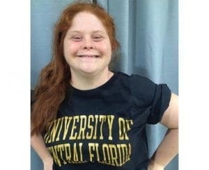Patricia smiles while wearing a University of Central Florida t-shirt.