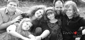 Michelle Rocker and her family in a black and white portrait.