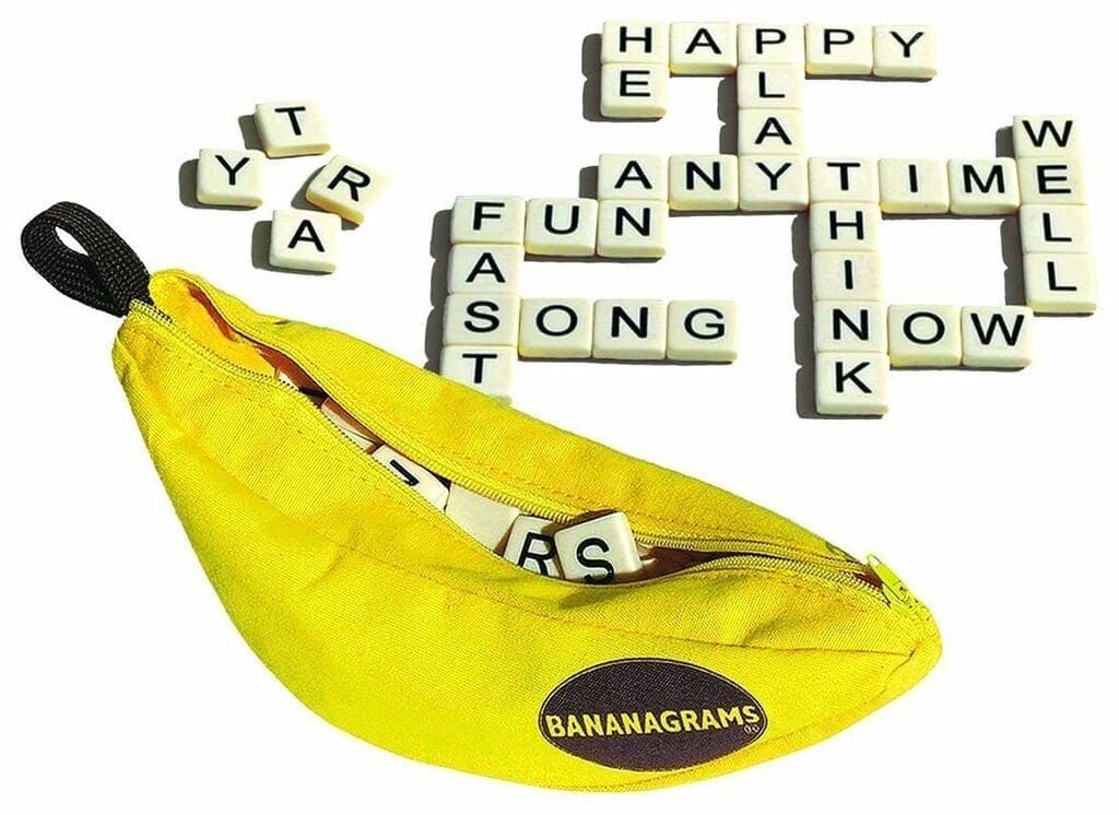 Bananagrams game with letter tiles spelling words and a banana-shaped pouch.