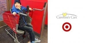 A person sits in a shopping cart designed for those with disabilities, next to the Caroline's Cart and Target logos.