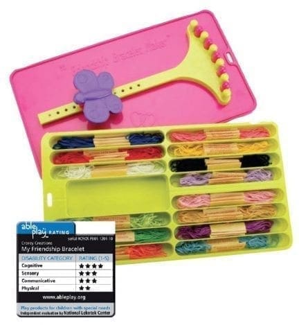 Friendship bracelet maker with colorful embroidery floss and a pink plastic loom.