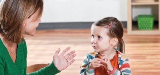 Woman talking to a young child about self-discipline.