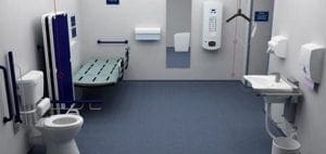 Accessible bathroom with toilet, changing table, and sink.