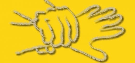 Two yellow hands making a puppet shape on a yellow background.