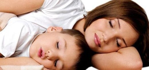 Woman and child sleeping peacefully together.