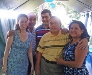 Carmen Noonan poses with her family under a tent.