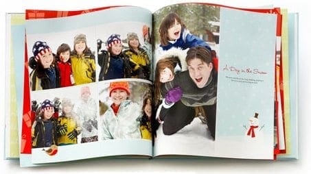 Photo album with images of children playing in the snow.