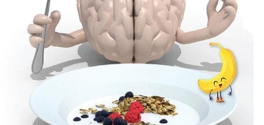 Brain holding a fork above a bowl of yogurt, berries, and granola.