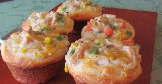 Chicken pot pie cupcakes filled with chicken, vegetables, and cheese.