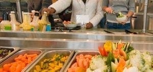 Buffet with salad bar and vegetables.