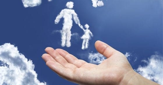 A hand reaches up towards cloud figures of an adult and child.