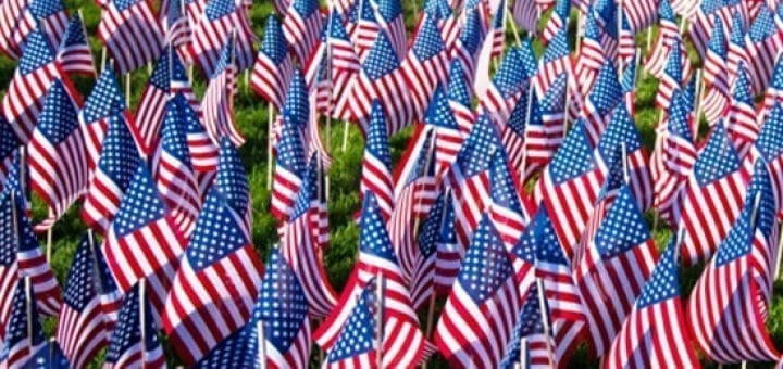 A field filled with American flags.