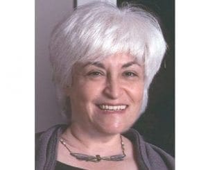 Judith Bluestone smiling.