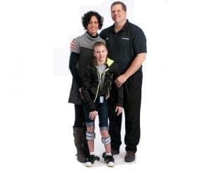 Family with a child in leg braces.