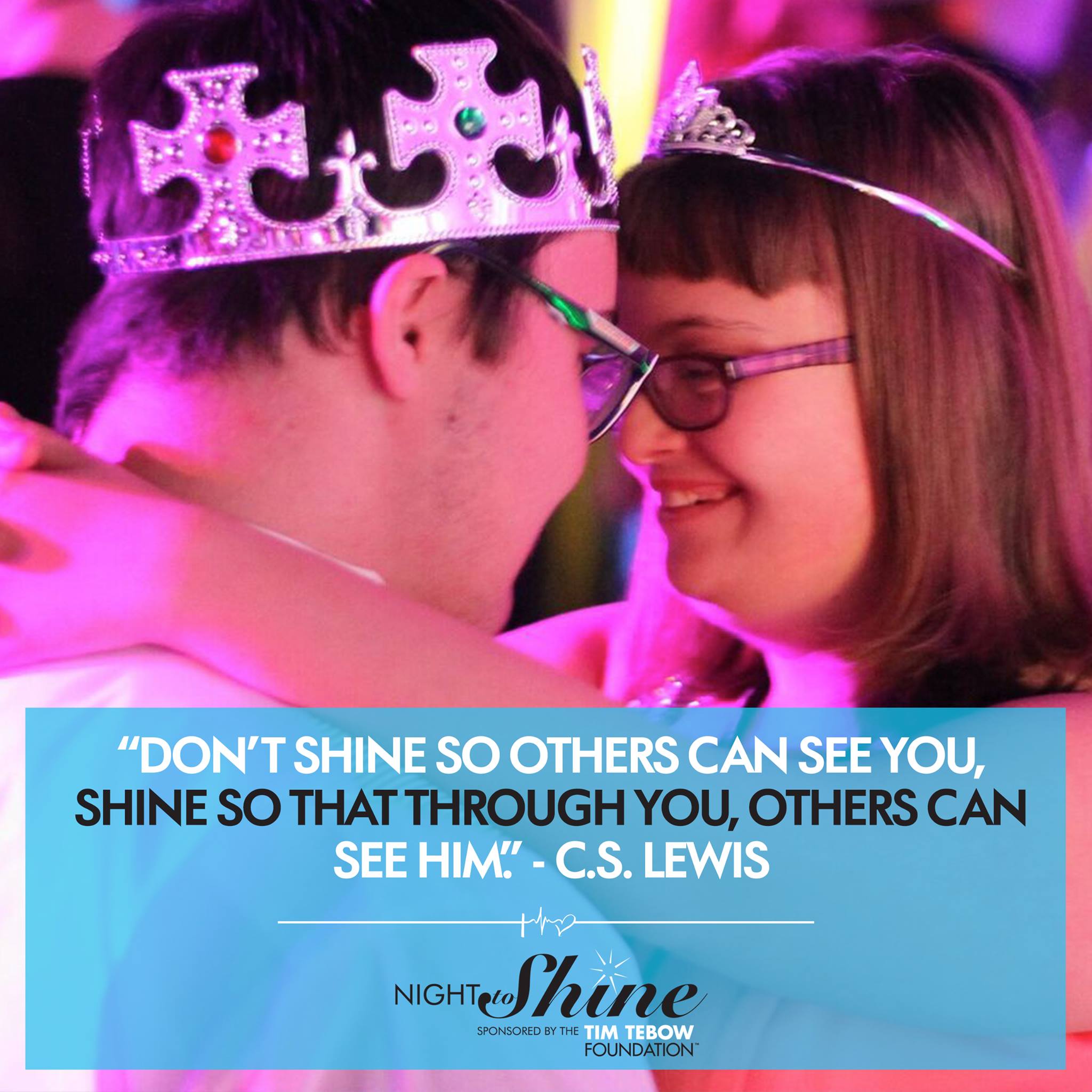 Couple wearing crowns and tiaras dancing.