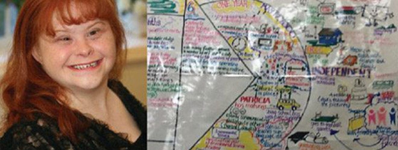 Patricia Moody smiles next to a hand-drawn PATH to Success diagram.