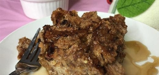 Peanut and apple butter French toast bake on a white plate with a fork.
