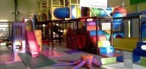 Indoor playground with slides and tunnels